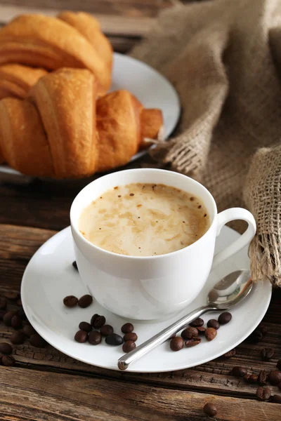 Delicious croissants with cup of coffee — Stock Photo, Image