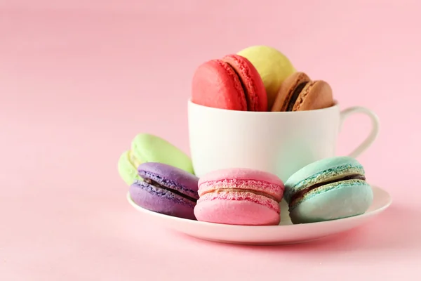 French colorful macarons in cup — Stock Photo, Image