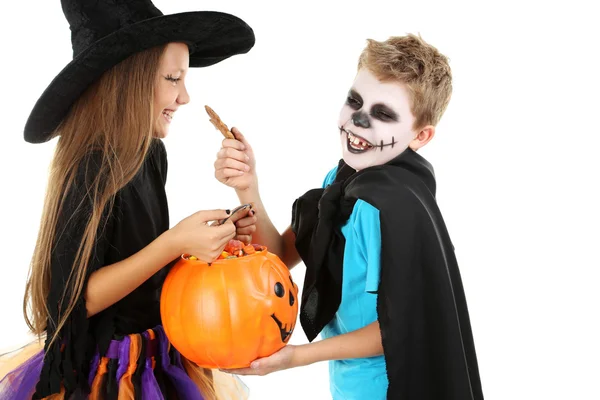 Beautiful girl witch and little boy with basket for candies on a — Stock Photo, Image