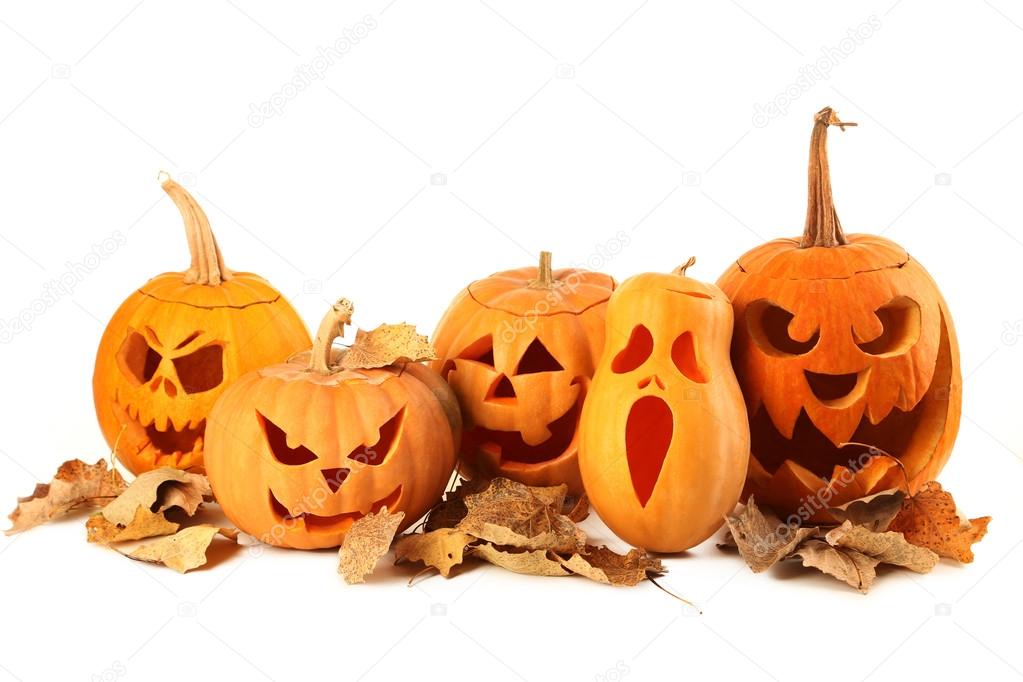 Halloween pumpkins with dry leaves