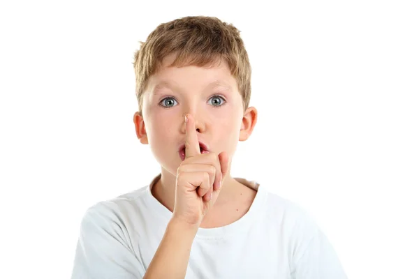 Little boy showing silence sign Stock Picture