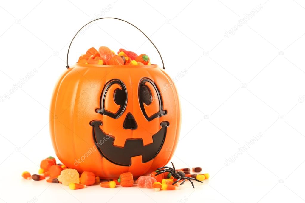 Halloween pumpkin basket full of candies