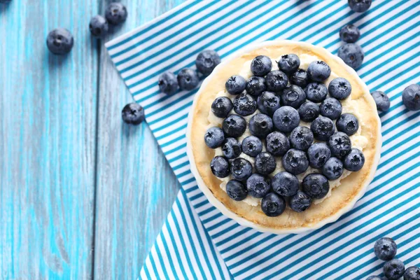 Blueberry tart on wooden table — Stock Photo, Image