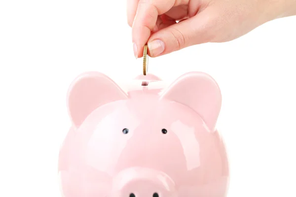 Putting coin into piggy bank — Stock Photo, Image