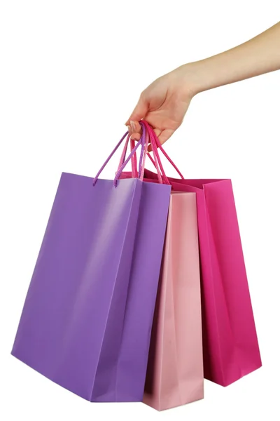 Mão feminina segurando sacos de compras — Fotografia de Stock