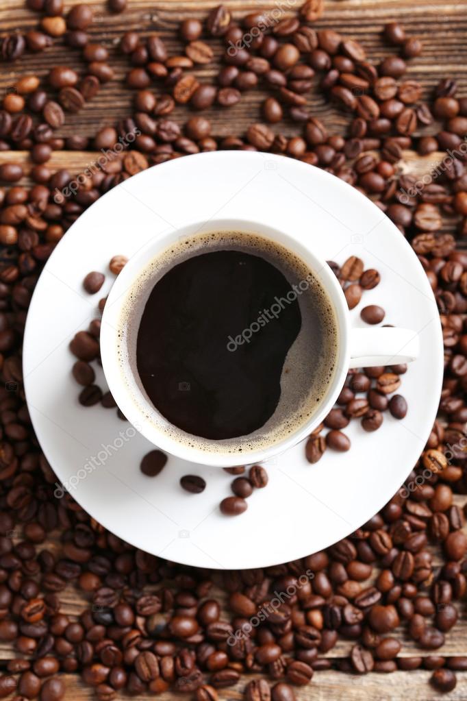 Cup of coffee with coffee beans