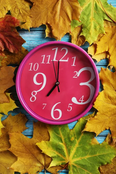 Autumn leaves  with clock — Stock Photo, Image