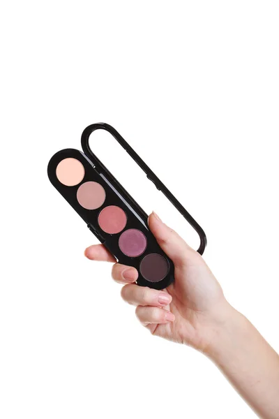 Mano femenina con paleta para maquillaje — Foto de Stock