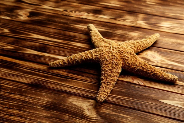 Starfish na mesa de madeira — Fotografia de Stock