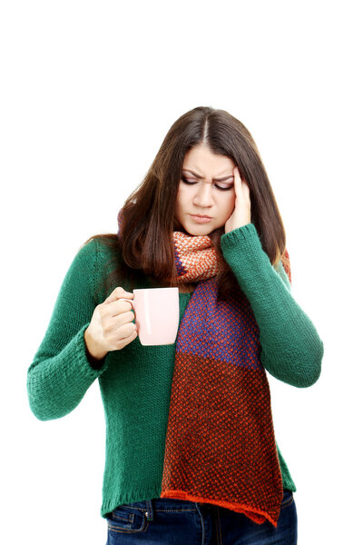 Sick girl with cup of hot drink