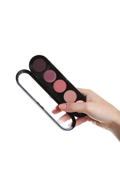 Mano femenina con paleta para maquillaje — Foto de Stock