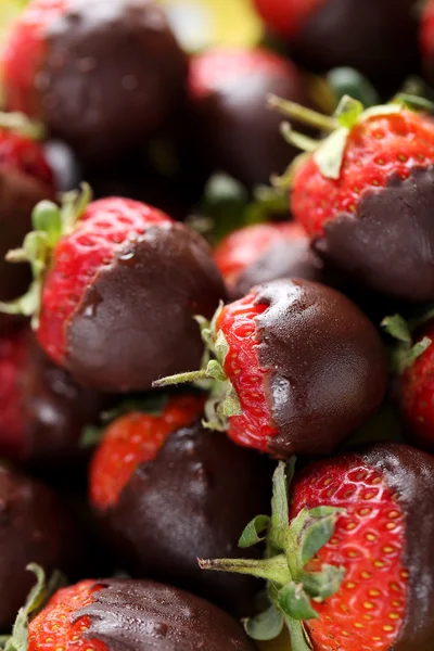 Strawberries dipped in dark chocolate — Stock Photo, Image