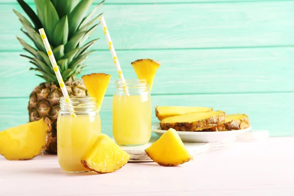 Bottles of pineapple juice — Stock Photo, Image