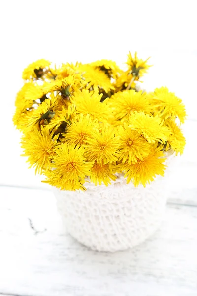 Yellow dandelions in basket — Stock Photo, Image