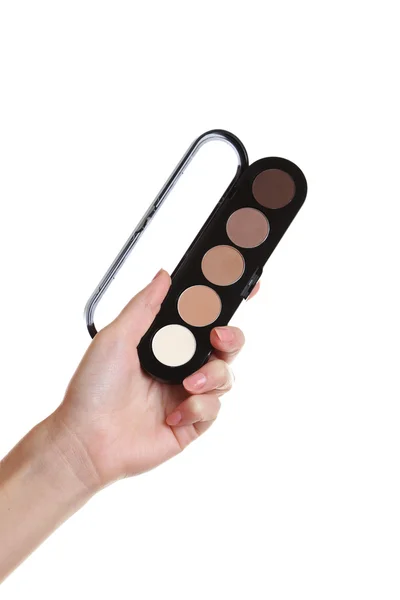 Mano femenina con paleta para maquillaje — Foto de Stock