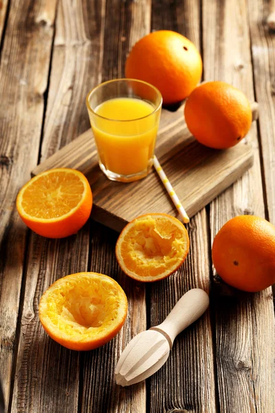 Citrus fruits with juicer — Stock Photo, Image