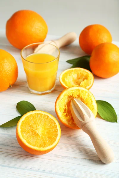 Citrus fruits with juicer — Stock Photo, Image