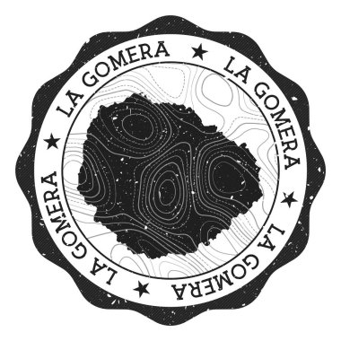La Gomera açık hava damgası. Üzerinde ada haritası ve topografik izolinler olan yuvarlak etiket.
