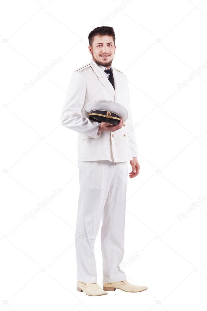 Navy Officer actor smiling in dress white uniform isolated