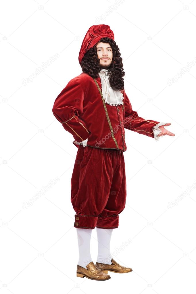 Portrait of the Middle Ages man in red costume isolated on white background