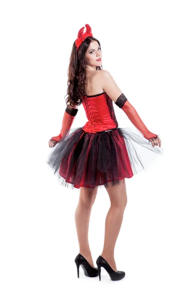 Playful young woman is wearing a sexy devil costume — Stock Photo, Image