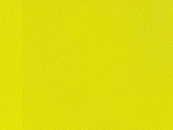 Artificial bright yellow material for backgrounds and textures.