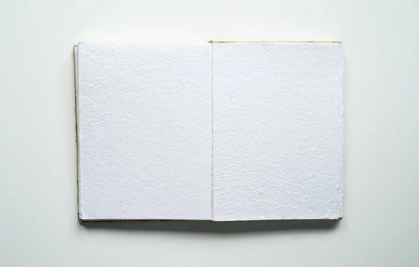 open notebook, space for text, canvas texture, rectangle, white background, photo taken from above