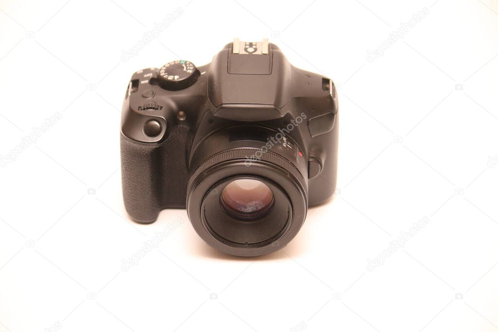 No logo digital single-lens reflex camera camera with 50 mm 1.8 aperture prime lens without hood. Front view studio shoot on white background