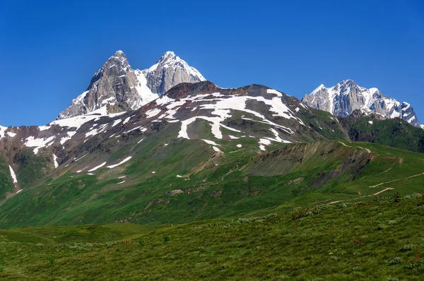 Two peaks of Mount Ushba. Main Caucasian Ridge. — Stock Photo, Image