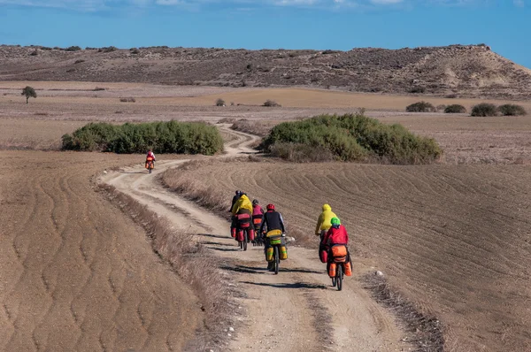 Cyclists riding on mountain serpentine — Stock Photo, Image