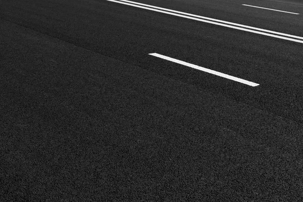 Asphalt road with marking lines white stripes Royalty Free Stock Photos