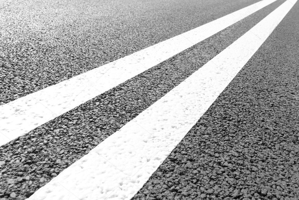 Asphalt road with marking lines white stripes