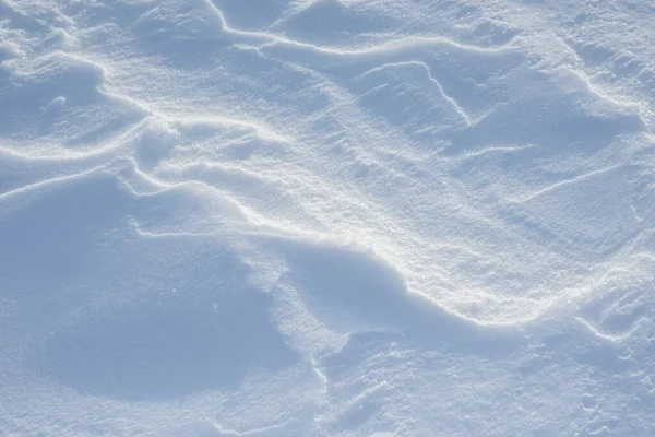 Fresh clean white snow background texture. Winter background with snowflakes and snow mounds. Snow lumps. Seasonal landscape details.