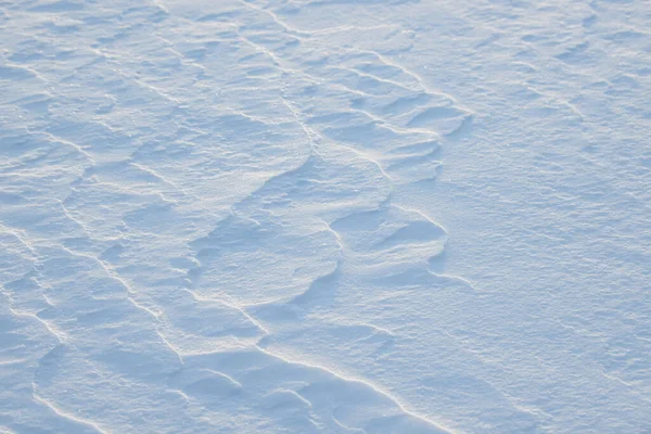 Fresh clean white snow background texture. Winter background with snowflakes and snow mounds. Snow lumps. Seasonal landscape details.