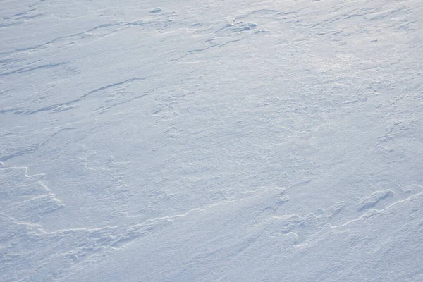 Fresh clean white snow background texture. Winter background with snowflakes and snow mounds. Snow lumps. Seasonal landscape details.