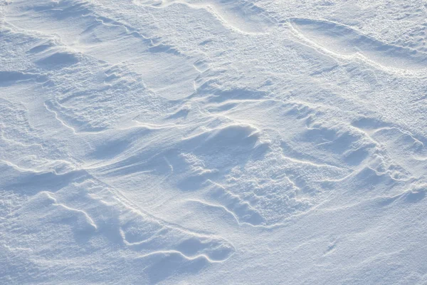 Fresh clean white snow background texture. Winter background with snowflakes and snow mounds. Snow lumps. Seasonal landscape details.