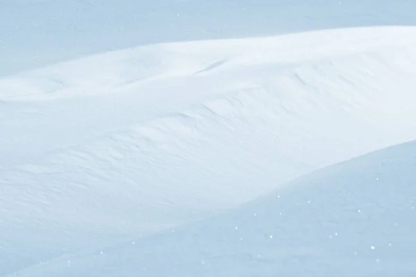 Fresh clean white snow background texture. Winter background with frozen snowflakes and snow mounds. Snow lumps. Seasonal landscape details. Cold weather.