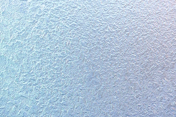 Patronen op vensterglas vorst in de winter. Matglas textuur. Blauw — Stockfoto