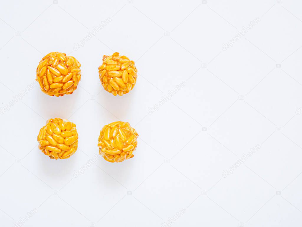 Flat lay of typical catalan marzipan dessert for All Saints day and autumn. Sweet treat for afternoon of tea time. White background and copy space
