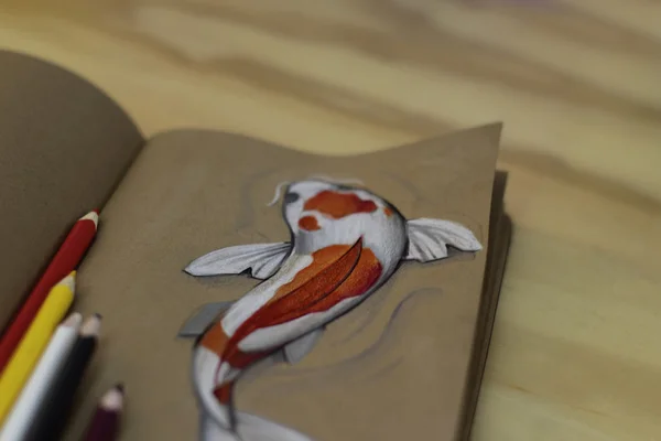 Koi fish drawing on a notebook — Stok Foto