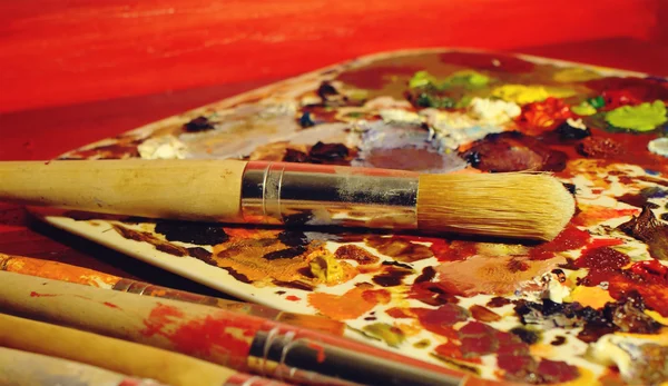 Oil paints and paint brushes — Stock Photo, Image
