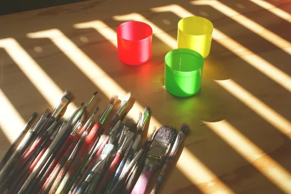 Paint brushes on table — Stock Photo, Image