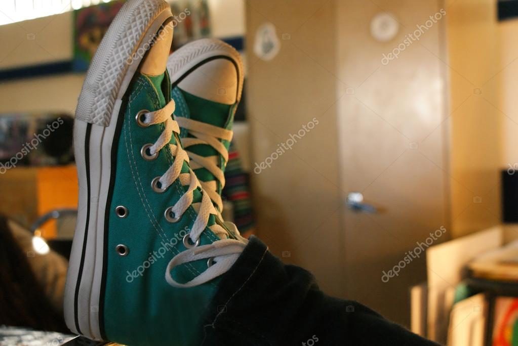Feet in sneakers on table — Stock Photo © bernardojbp 92124014