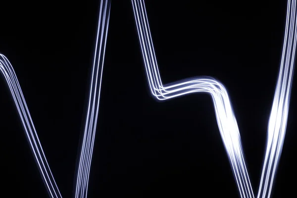 Desenho de linhas de luz abstrata — Fotografia de Stock