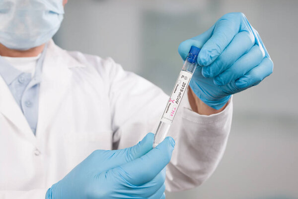 doctor's hands handling a coronavirus test in a medical laboratory 
