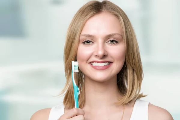 Young Smiling Blonde Woman Shows Her White Teeth Presents Her — Stock Photo, Image