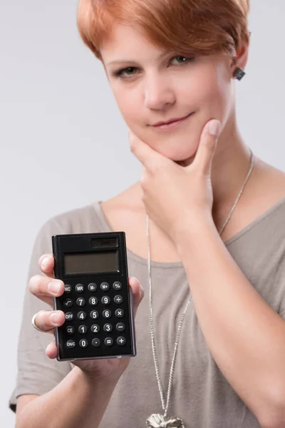 Young Thinking Woman Using Calculator — Stock Photo, Image