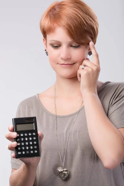 Young Thinking Woman Using Calculator — Stock Photo, Image