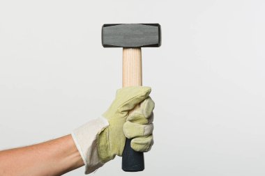 İş eldivenini çekiçle ver. 