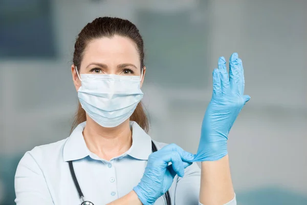 Female Doctor Nurse Puts Her Medical Gloves — Stock Photo, Image